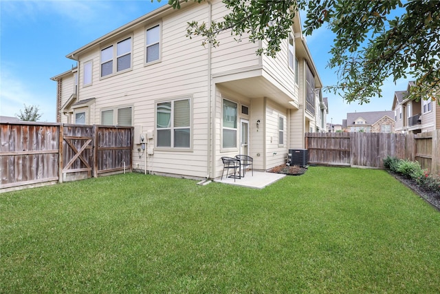 back of property with a patio area, central AC, a lawn, and a fenced backyard