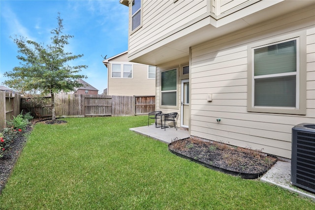 view of yard with a patio, cooling unit, and a fenced backyard