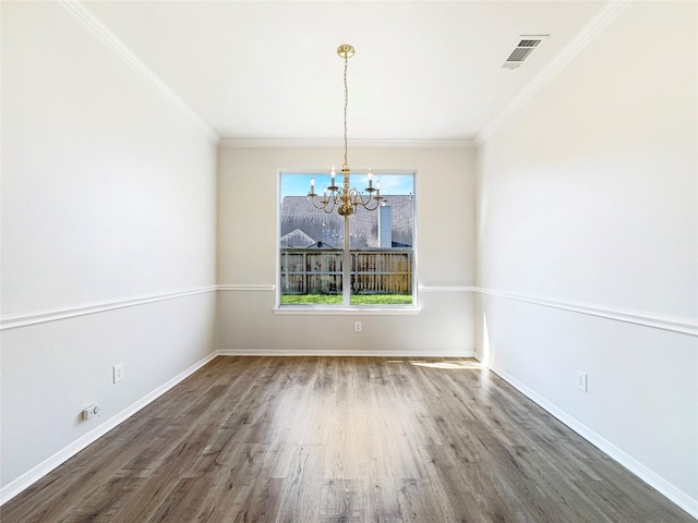 unfurnished dining area with dark wood-style floors, baseboards, visible vents, and crown molding