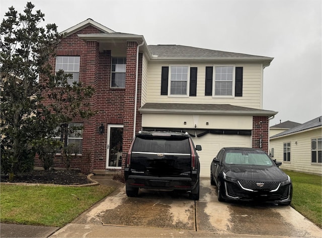 traditional-style house with a garage, concrete driveway, and brick siding