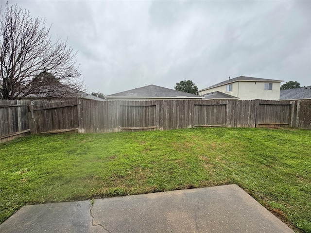 view of yard with a fenced backyard