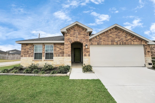 view of front of property with brick siding, concrete driveway, an attached garage, stone siding, and a front lawn