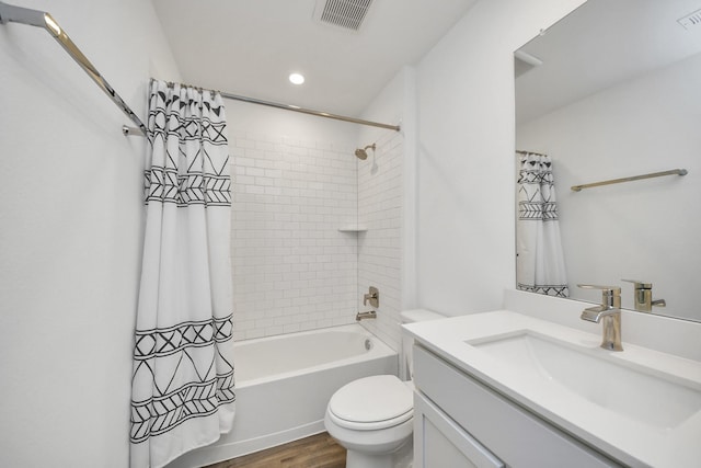 full bathroom with toilet, visible vents, shower / bath combination with curtain, and vanity