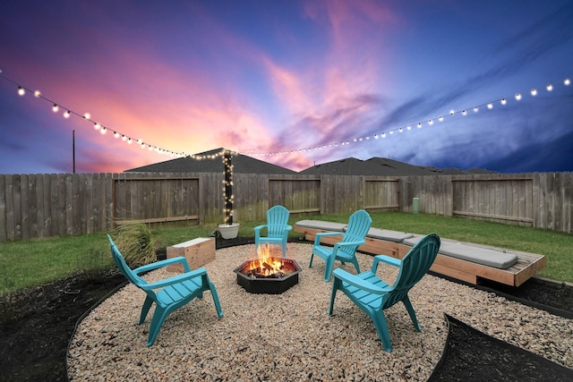 view of yard with an outdoor fire pit and a fenced backyard