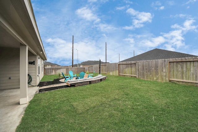 view of yard with a fenced backyard