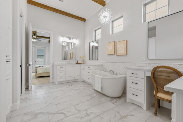 full bathroom featuring connected bathroom, vanity, marble finish floor, ornamental molding, and wainscoting