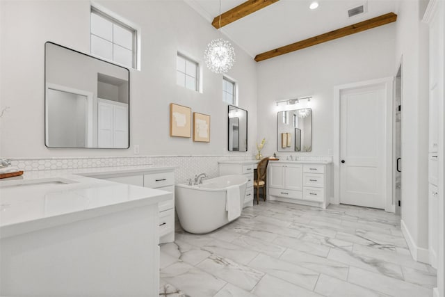 full bathroom featuring marble finish floor, visible vents, two vanities, and beamed ceiling