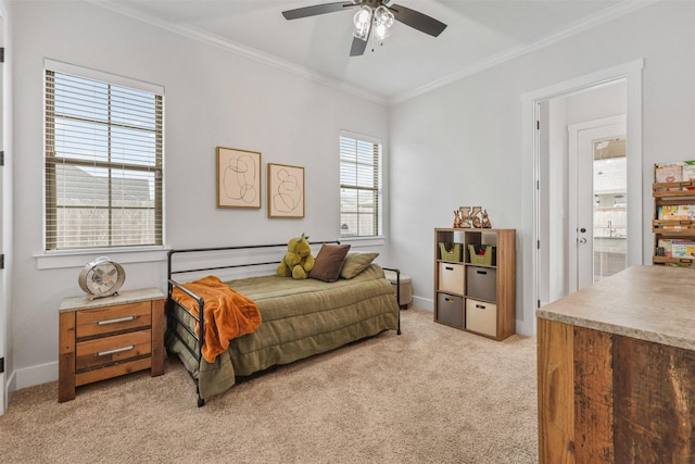 bedroom with ornamental molding, light colored carpet, ceiling fan, and baseboards