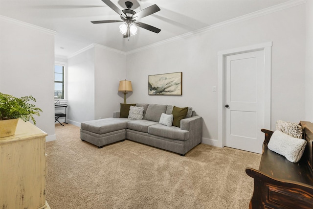 living area with carpet flooring, crown molding, baseboards, and ceiling fan