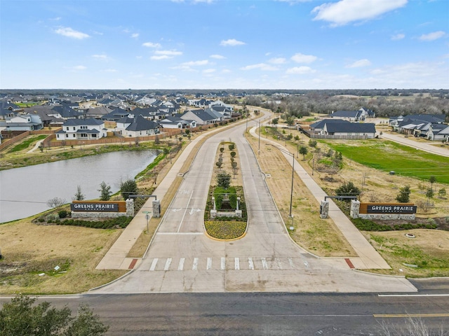 bird's eye view featuring a water view and a residential view