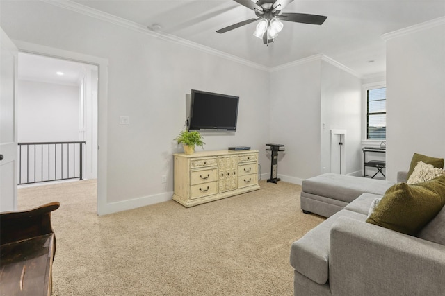 living area with ornamental molding, carpet, and baseboards