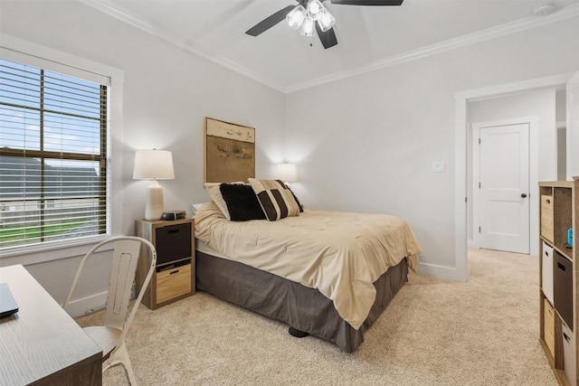 bedroom featuring baseboards, ornamental molding, ceiling fan, and light colored carpet