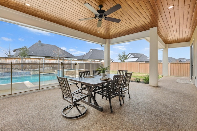 view of patio with a fenced backyard, outdoor dining area, and a ceiling fan