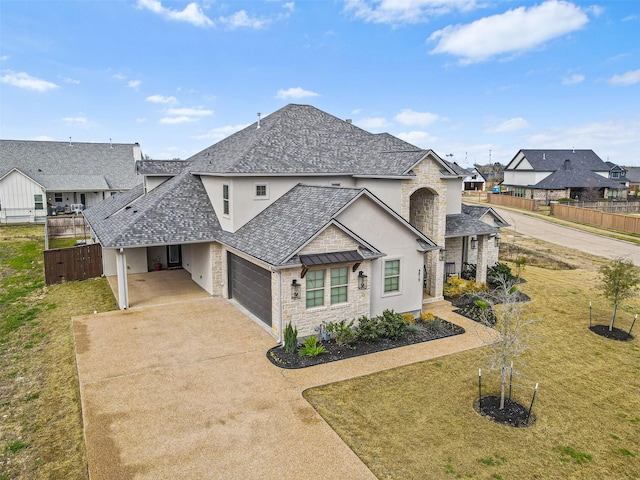 french provincial home featuring stone siding, a residential view, a front lawn, and concrete driveway