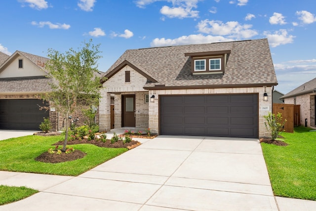 21659 Wave Hollow Dr, Cypress, TX 77433 - view of front of house featuring brick siding, a shingled roof, driveway, and an attached garage