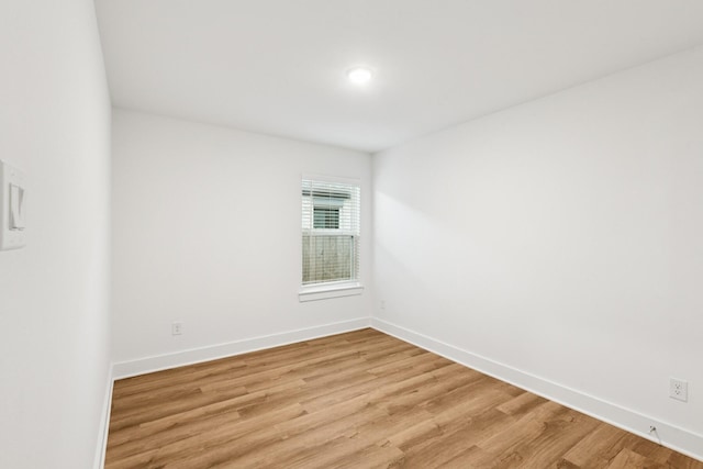 21659 Wave Hollow Dr, Cypress, TX 77433 - spare room with light wood-style floors and baseboards