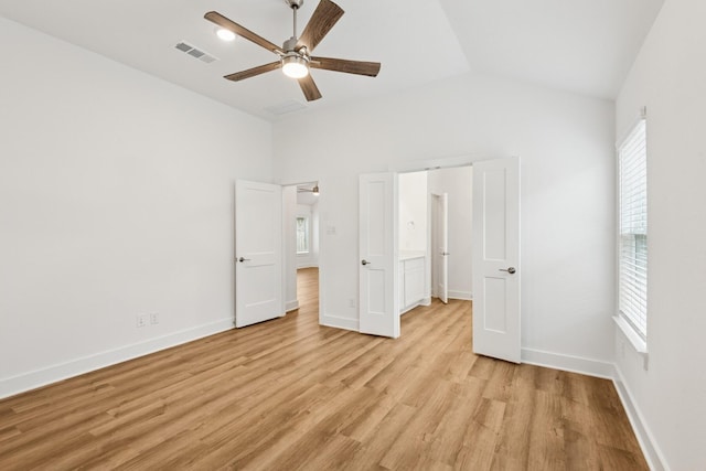 21659 Wave Hollow Dr, Cypress, TX 77433 - unfurnished bedroom featuring lofted ceiling, light wood-style floors, and ceiling fan