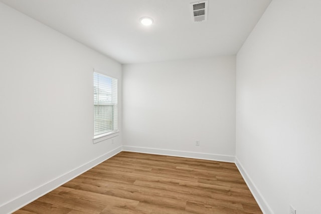 21659 Wave Hollow Dr, Cypress, TX 77433 - empty room with baseboards and light wood-type flooring