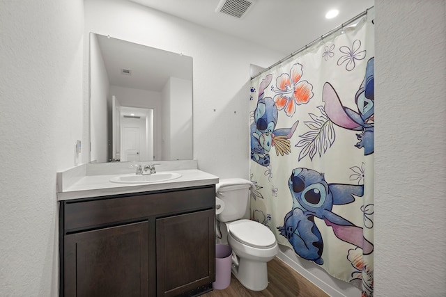 1730 Windstone Ridge Dr, Houston, TX 77014 - full bath featuring vanity, wood finished floors, curtained shower, and a textured wall