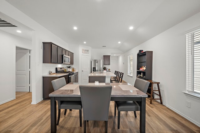 1730 Windstone Ridge Dr, Houston, TX 77014 - dining room featuring light wood finished floors and recessed lighting