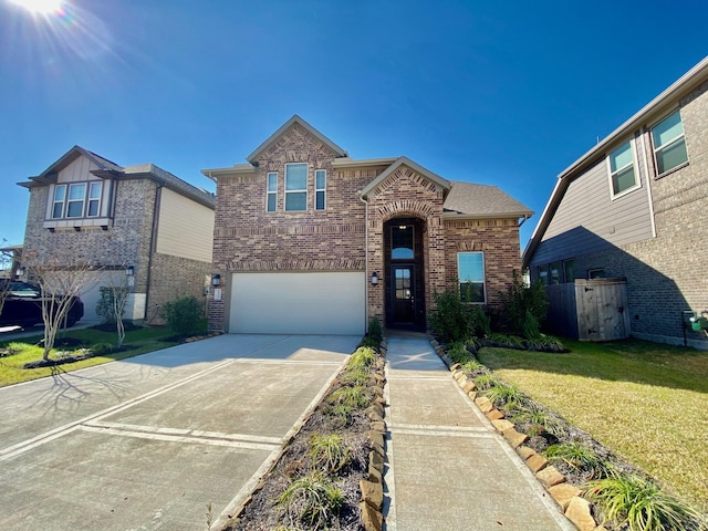 view of front facade featuring driveway, a front yard, a garage, and brick siding