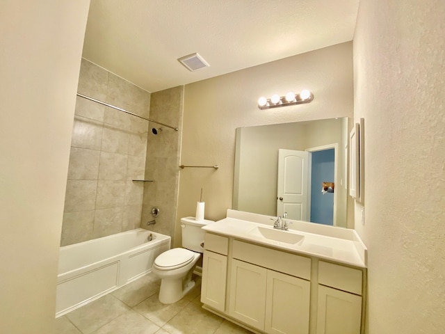 bathroom featuring visible vents, toilet, tile patterned floors, vanity, and shower / washtub combination