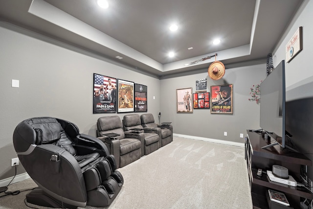 home theater featuring carpet floors, a tray ceiling, recessed lighting, and baseboards