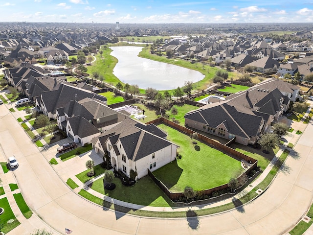 birds eye view of property featuring a water view and a residential view