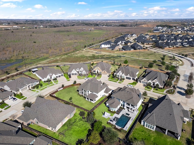 birds eye view of property with a residential view