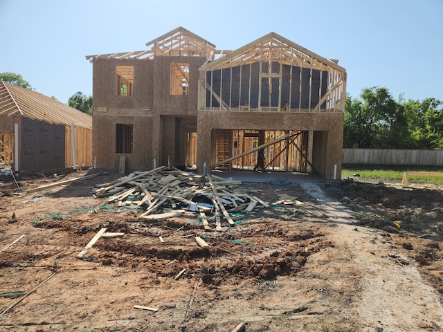 view of front of property featuring fence