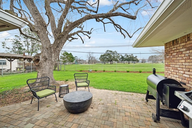 view of patio featuring fence and grilling area