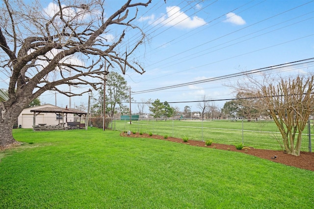 view of yard featuring fence and a gazebo