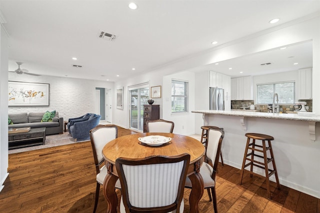 dining space with dark wood-type flooring, recessed lighting, and visible vents