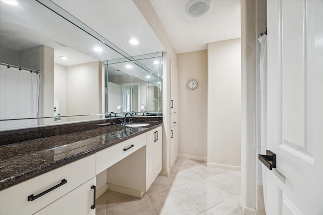 full bath featuring baseboards, recessed lighting, vanity, and tile patterned floors