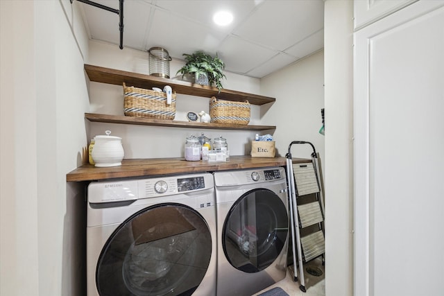 washroom featuring laundry area and separate washer and dryer