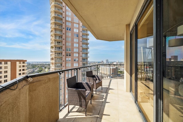 balcony featuring a city view