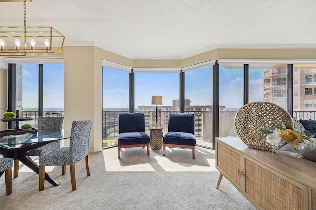 sunroom / solarium with a chandelier, a view of city, and a healthy amount of sunlight