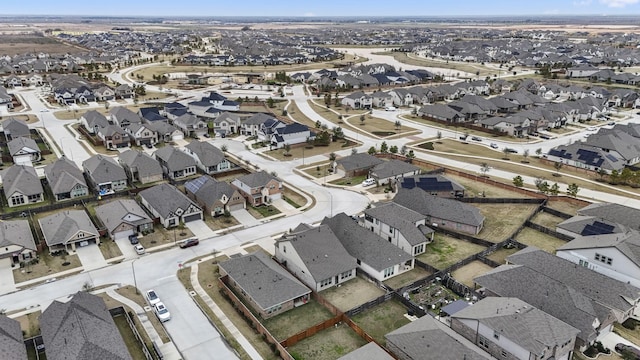 birds eye view of property with a residential view