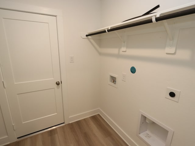 8022 Kay Harbor Dr, Cypress, TX 77433 - laundry room featuring electric dryer hookup, hookup for a washing machine, baseboards, and dark wood-style floors