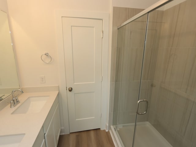 8022 Kay Harbor Dr, Cypress, TX 77433 - full bath with double vanity, a shower stall, and wood finished floors