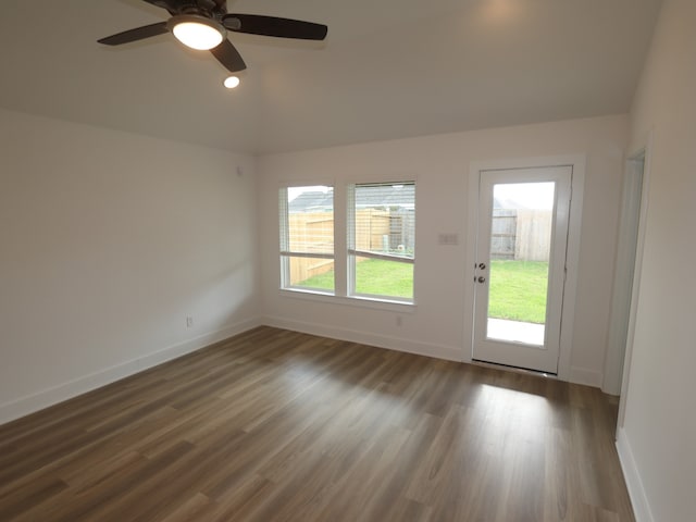 8022 Kay Harbor Dr, Cypress, TX 77433 - empty room with baseboards, wood finished floors, ceiling fan, vaulted ceiling, and recessed lighting
