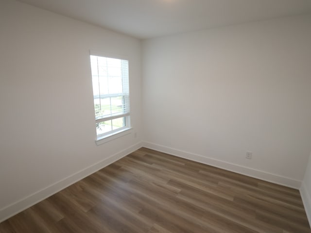 8022 Kay Harbor Dr, Cypress, TX 77433 - spare room with dark wood finished floors and baseboards