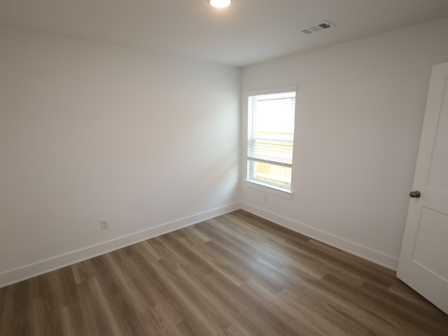 8022 Kay Harbor Dr, Cypress, TX 77433 - unfurnished room with baseboards and wood finished floors