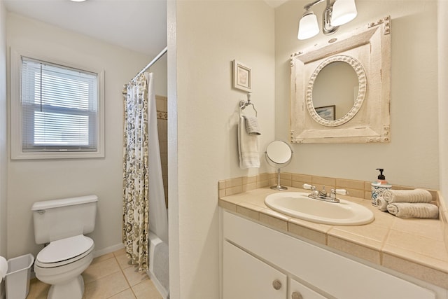 bathroom with shower / tub combo, baseboards, toilet, tile patterned floors, and vanity