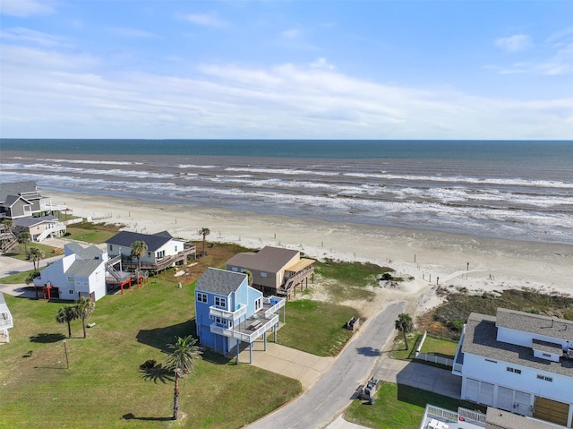 aerial view with a beach view, a residential view, and a water view