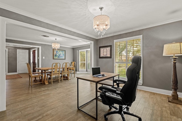 office featuring baseboards, wood finished floors, visible vents, and a notable chandelier