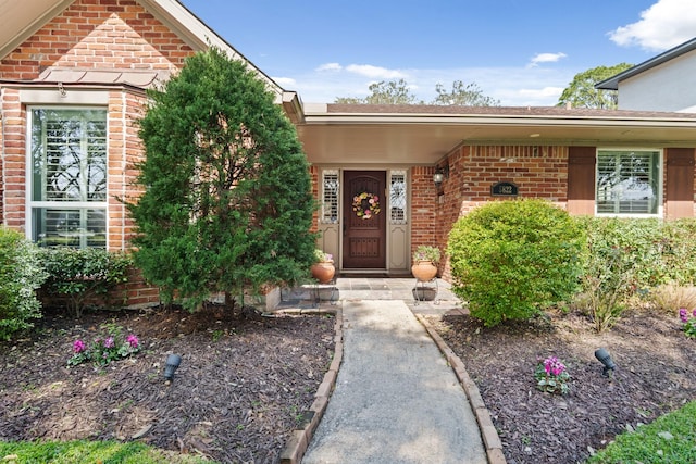 entrance to property with brick siding