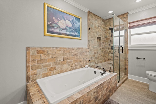 bathroom with toilet, ornamental molding, a shower stall, a jetted tub, and baseboards