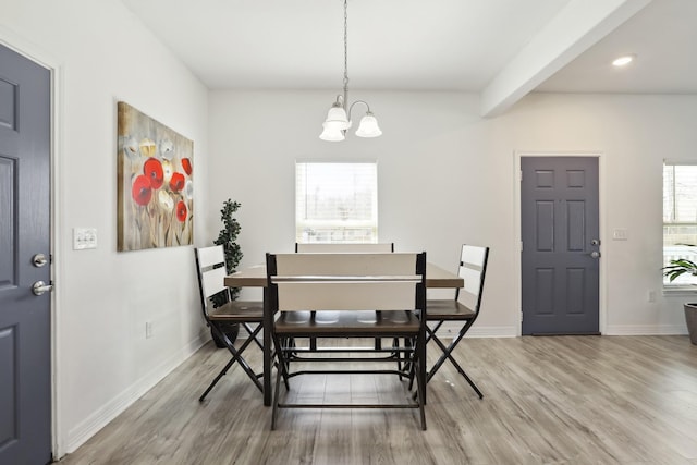 dining space featuring recessed lighting, wood finished floors, baseboards, beamed ceiling, and an inviting chandelier