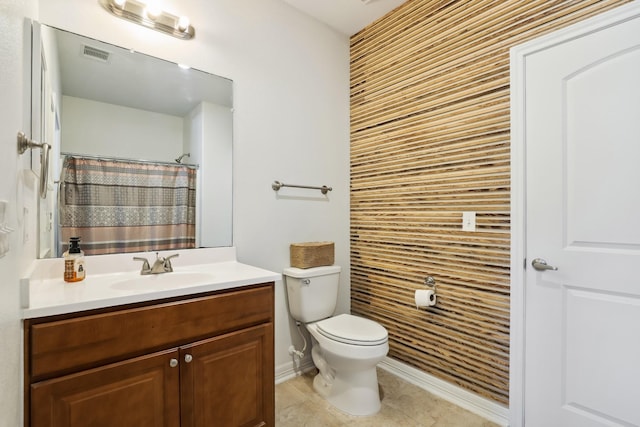 full bathroom featuring tile patterned flooring, toilet, vanity, visible vents, and baseboards